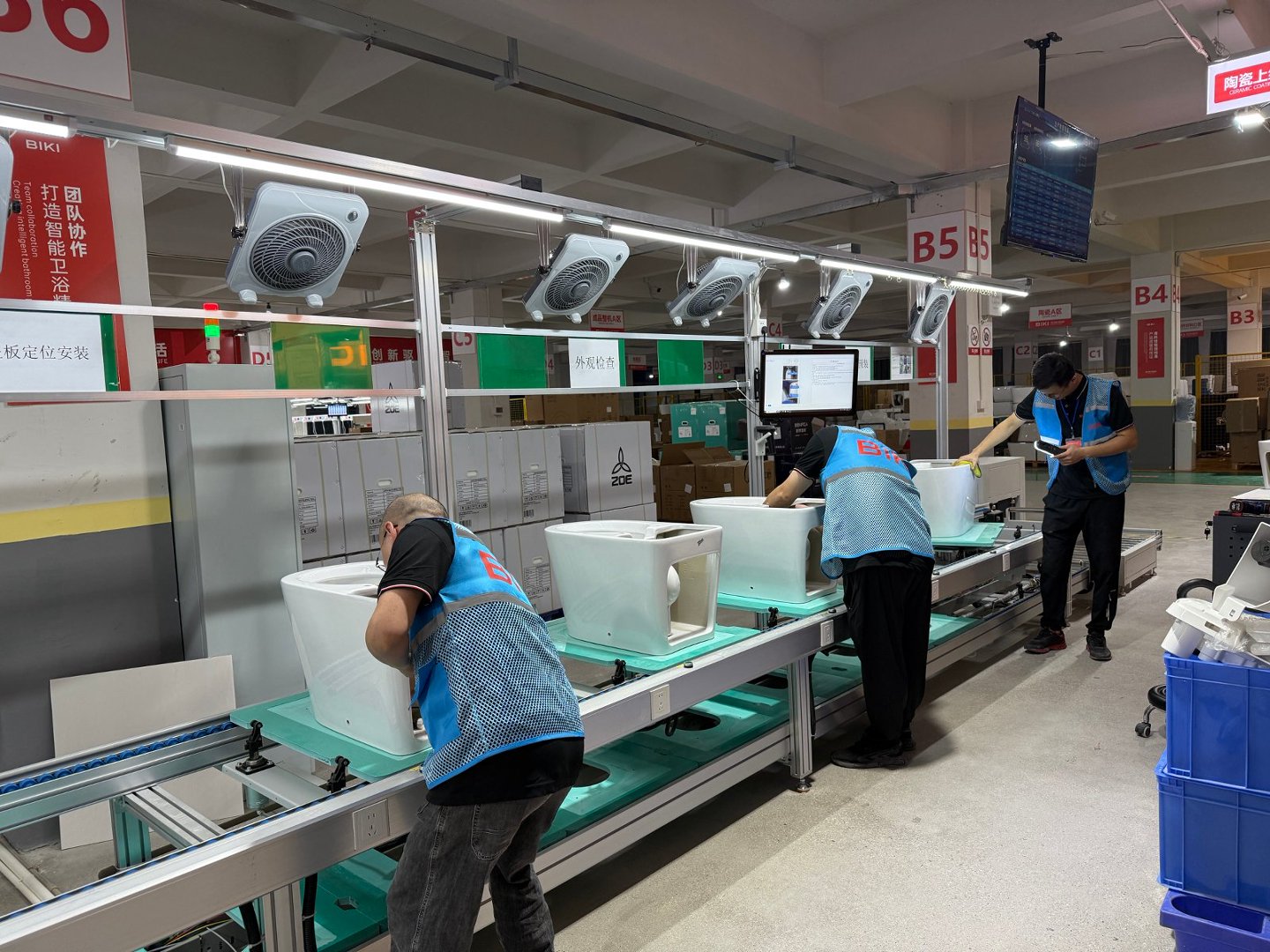 BIKI team inspecting smart toilet ceramics during production